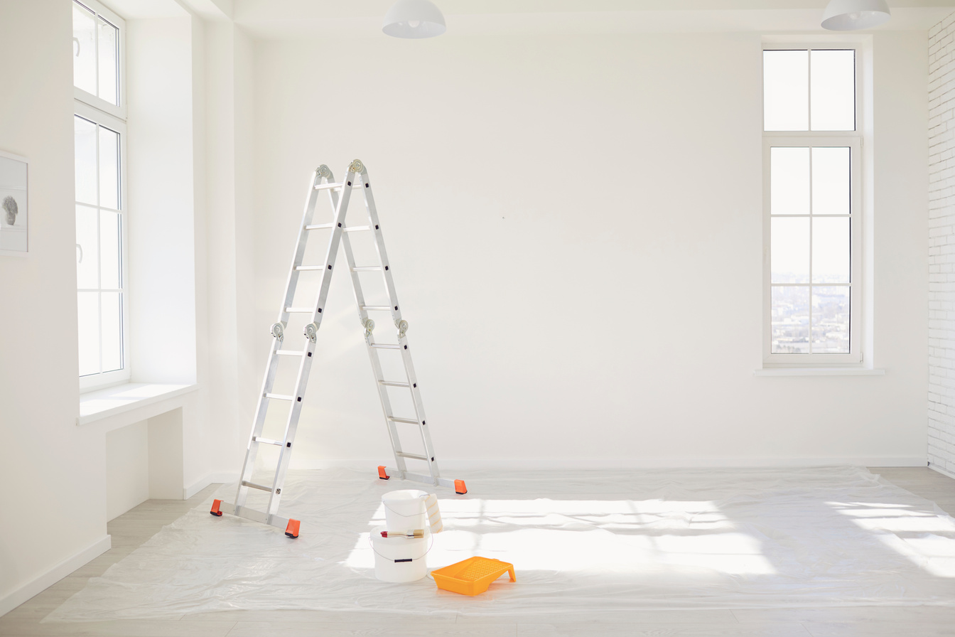 Painting in a White Room with Windows with a Stepladder